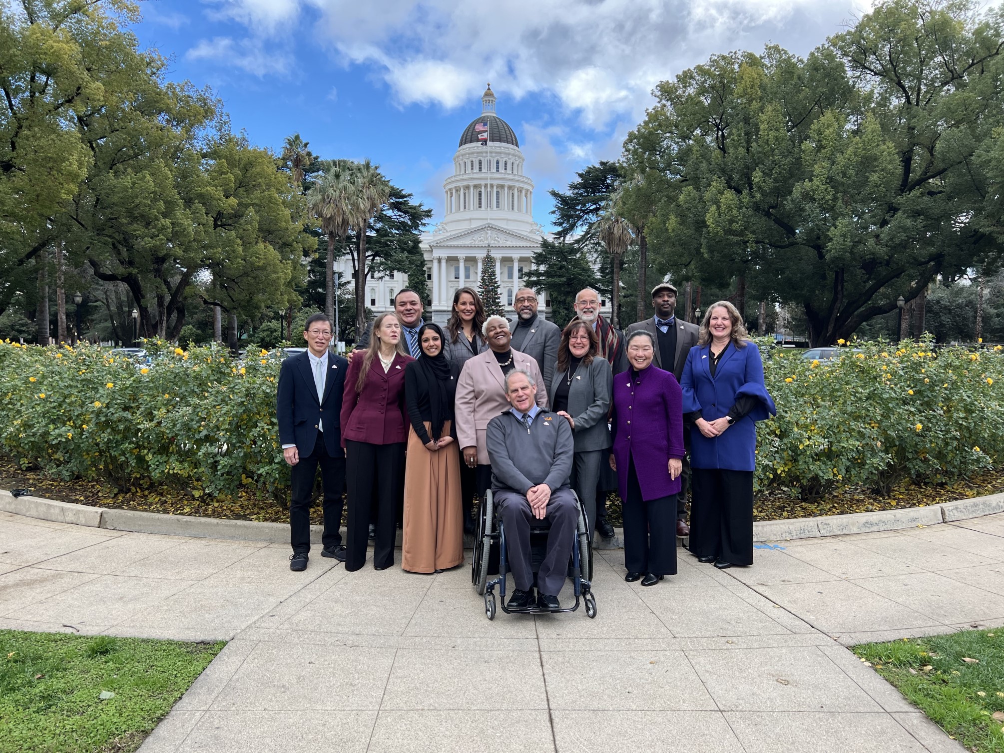 Members of the commission in front the capital building in Sacramento.